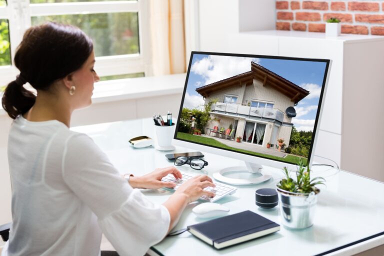 woman working on a vacation property listing online