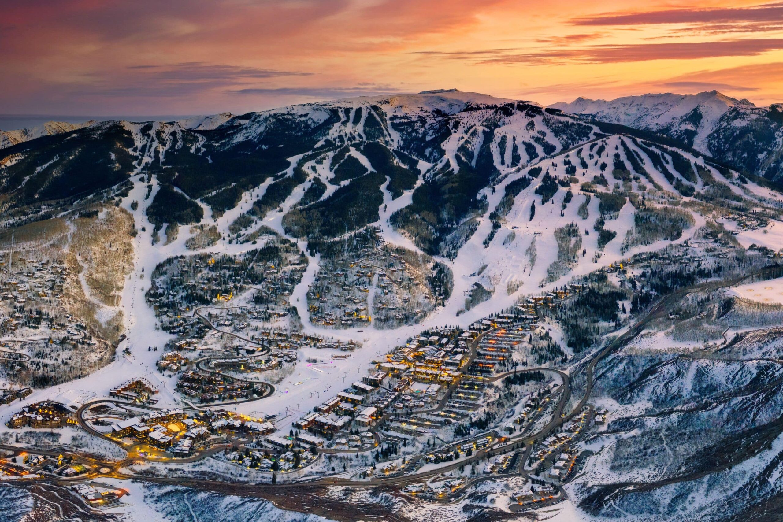 aerial shot of Snowmass ski area and village at sunset