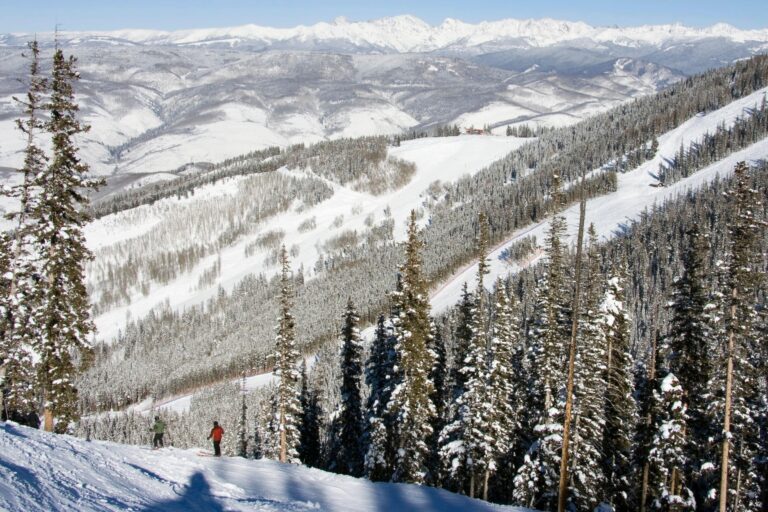 two people appearing quite small against the expanse of Beaver Creek runs