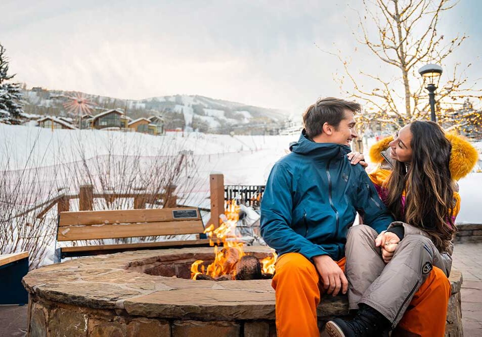 Couple by firepit in Snowmass, CO